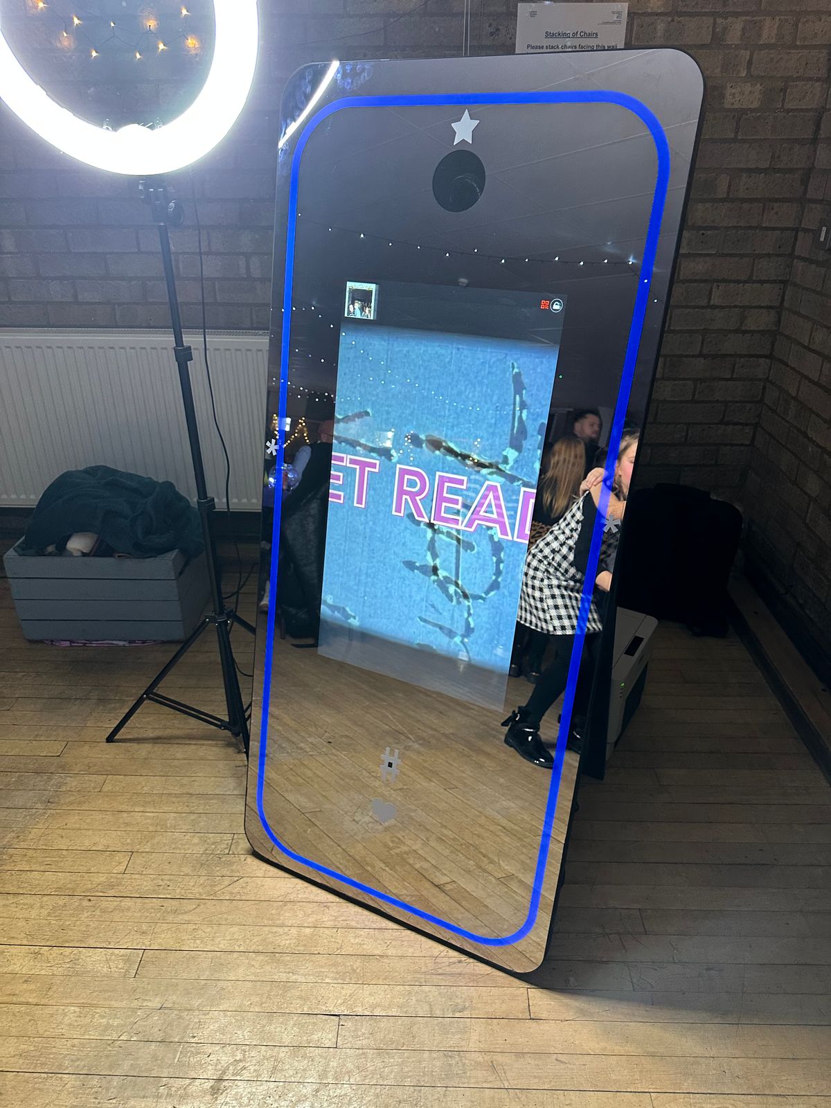 Magic mirror photo booth with ring light and animated screen